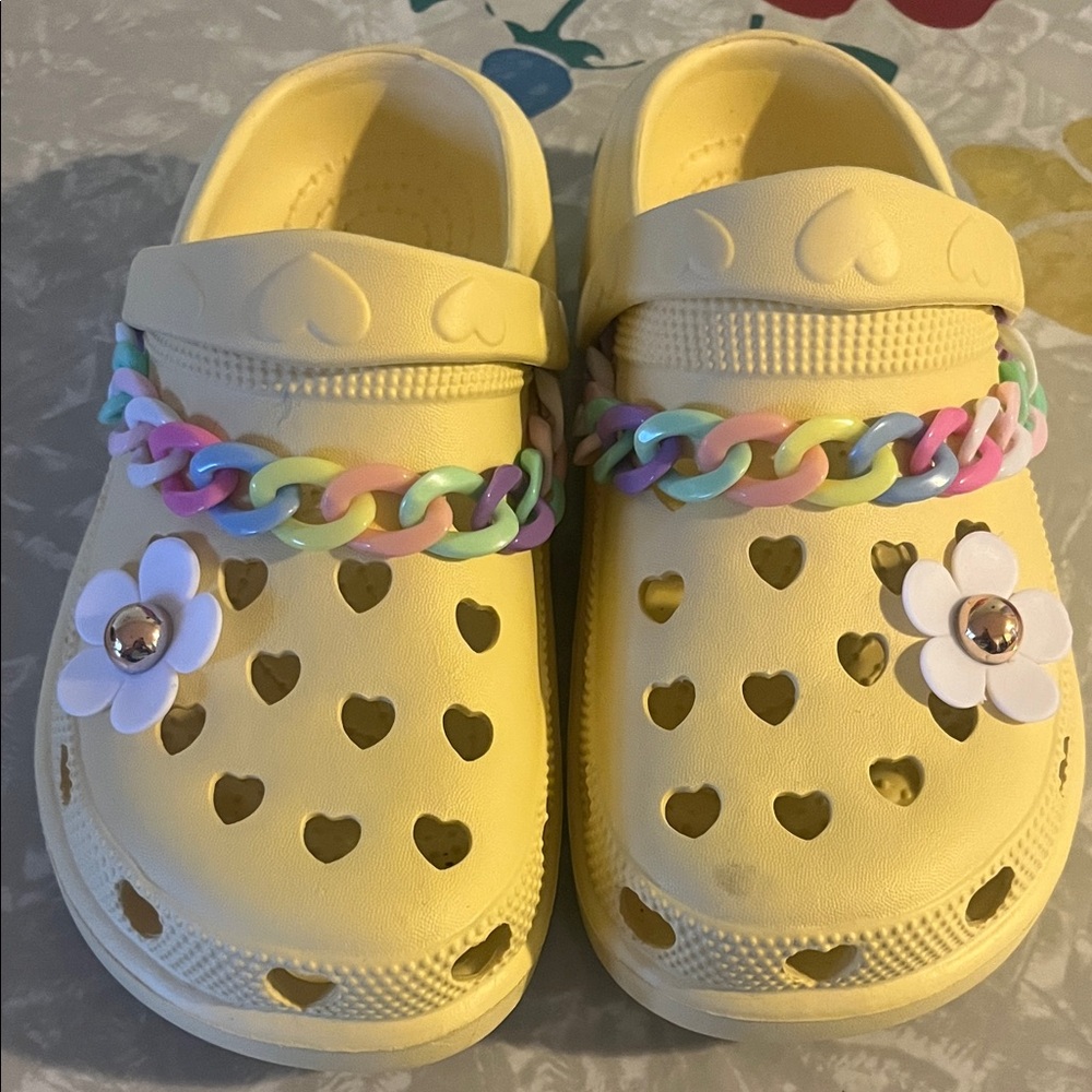 Butter Yellow Kids Clogs with Heart Cutouts pastel chain daisy charm